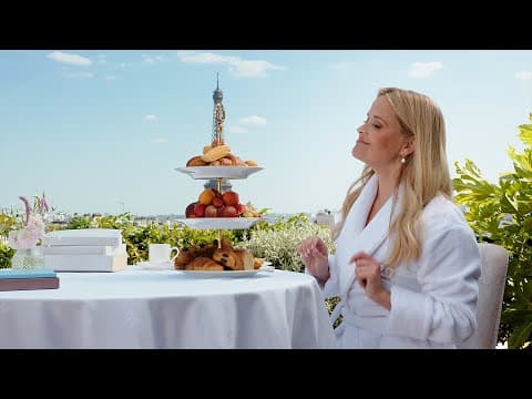 Reese Witherspoon takes in a lovely view of the Eiffel Pastry.